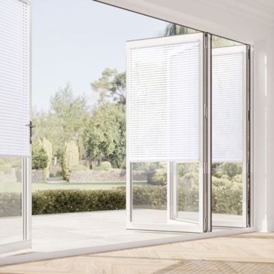 White, no-drill Venetian blinds on bifold doors 