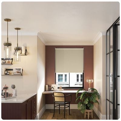 Beige no-drill roller blind in kitchen window