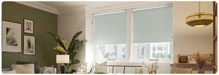 Beige, Roman blinds in a panelled, two-tone neutral bedroom