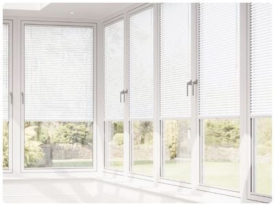 Modern living room with stick-on blinds for patio doors. 