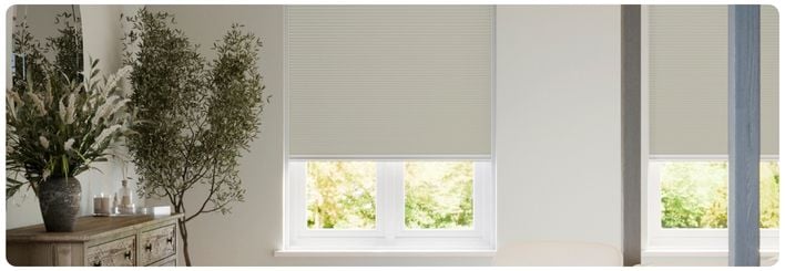 Modern, neutral living room featuring our no-drill shutters
