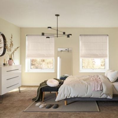 Cream Roman blinds in a neutral bedroom 