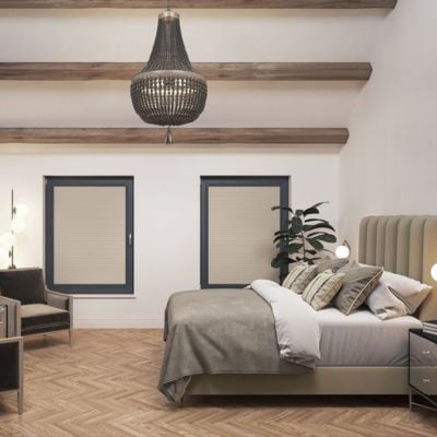 Taupe blackout, thermal pleated blinds with anthracite frames on bedroom windows.