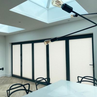 Light filtering pleated blinds on bi fold doors