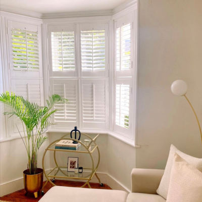 tier on tier shutters in an angled bay window 