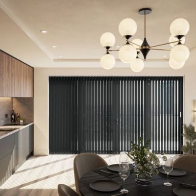 Black, vertical blinds over a bifold door