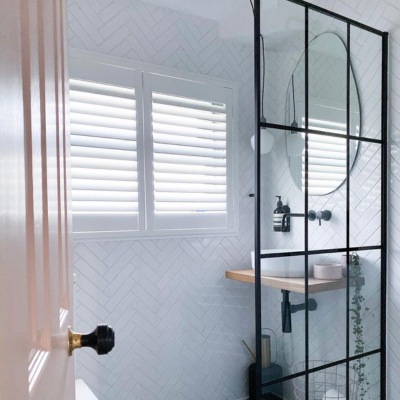 Faux wooden shutters in a bathroom window