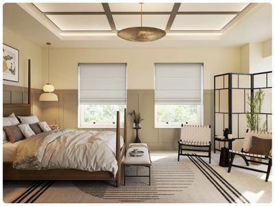 Modern bedroom featuring linen roman blinds. 