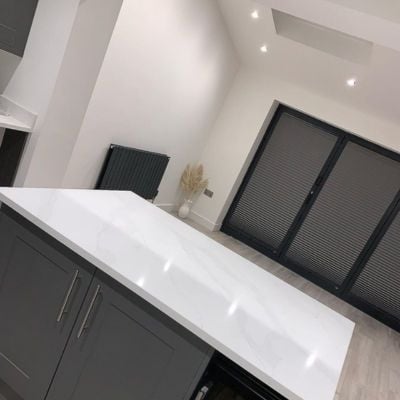 Grey pleated blinds on anthracite bifold doors 