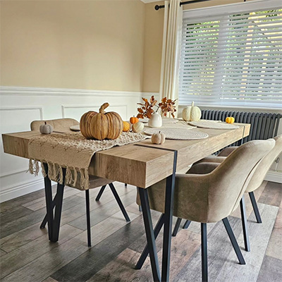 Autumn-themed table scape with pumpkins and foliage.