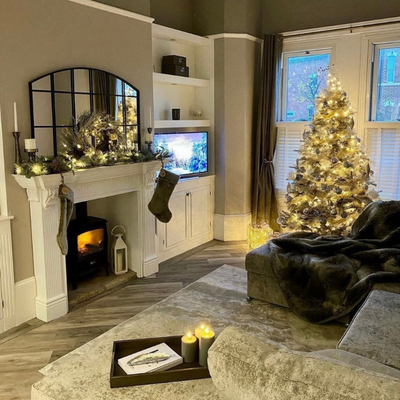Christmas decorated living room with cafe shutters.