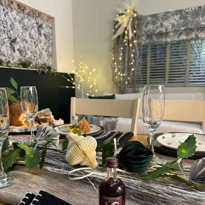 Green and silver decorated Christmas table.