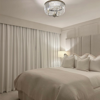 Modern neutral bedroom with no-drill stick on blackout blinds in the windows