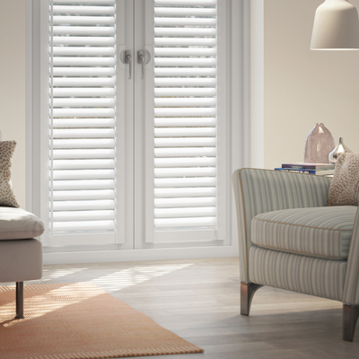 No drill perfect fit shutters shown installed in French patio doors. 