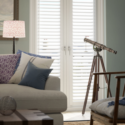 White perfect fit shutters on French doors.