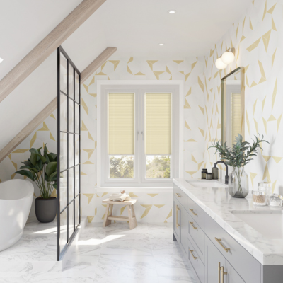 Creamy yellow stick on blind on patio doors in a bathroom.