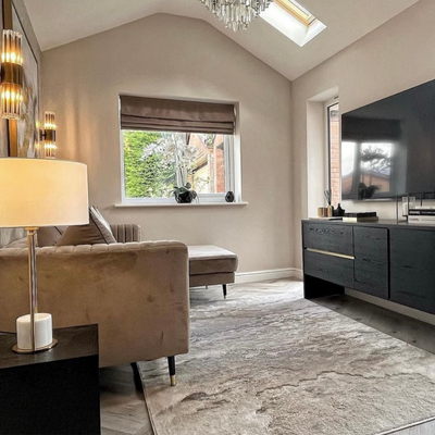 Neutral luxe living room with faux silk roman blind.