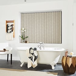 A brown patterned vertical blind in a modern bathroom