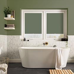 An image showing two green perfect fit roller blinds with green walls