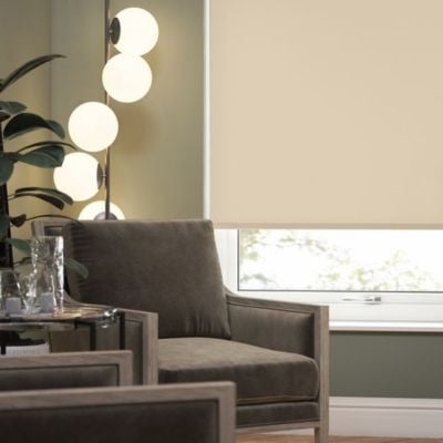 a beige, no-drill roller blind in a modern, green living room.