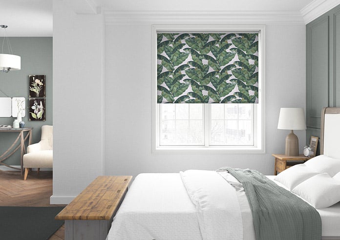 A beautiful tropical pattern roller blind in a grey bedroom