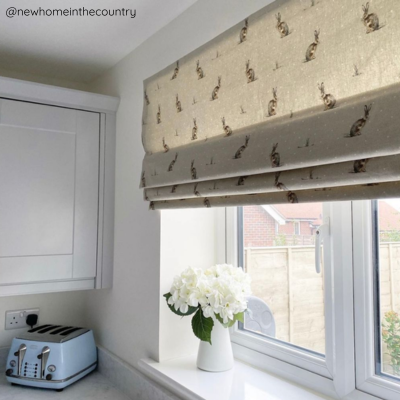 printed roman blind in a kitchen window