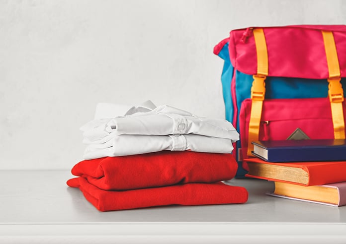 School uniform and bag organised and folded