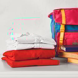 School uniform and bag organised and folded