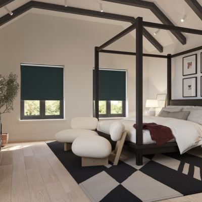 Black blackout roller blind in bedroom 