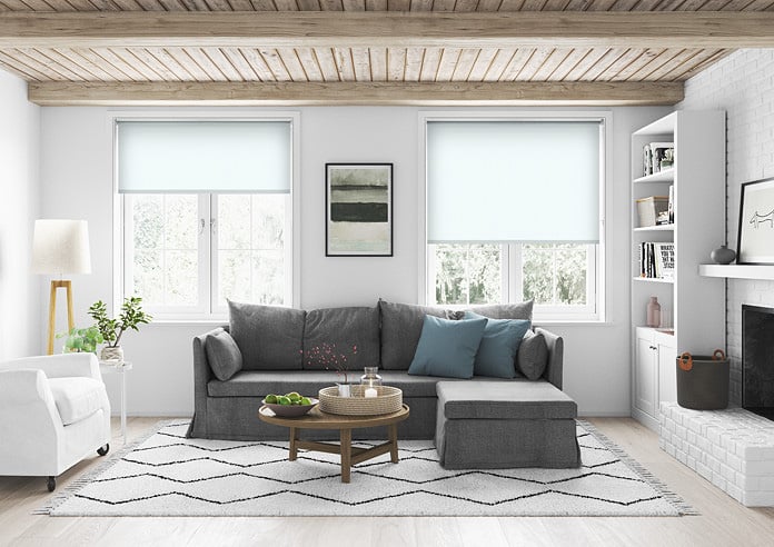 A white roller blind in a living room