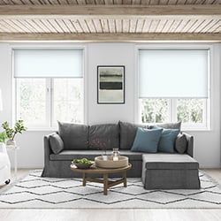 A white roller blind in a living room