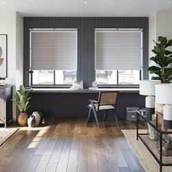 A pair of grey patterned roller blind a large open plan living room