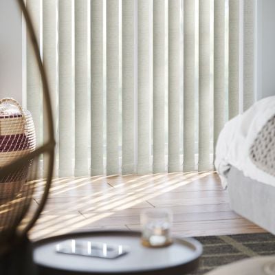 Light grey vertical blinds in modern living room. 