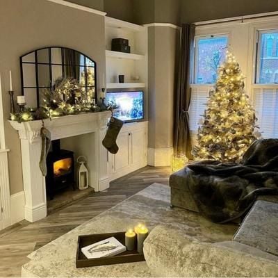 A warm white Christmas Tree in a grey living room