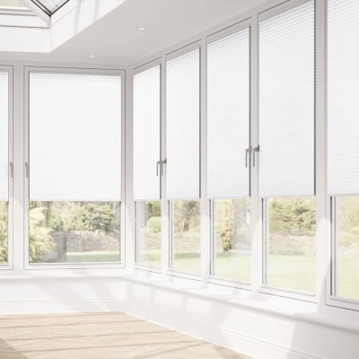 White pleated clip fit blinds in large conservatory windows
