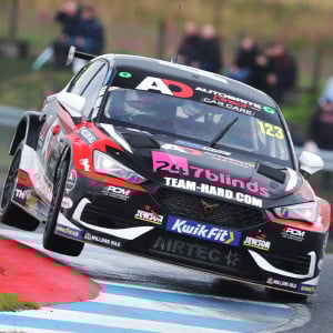 Dan Lloyd holding up his BTCC trophy