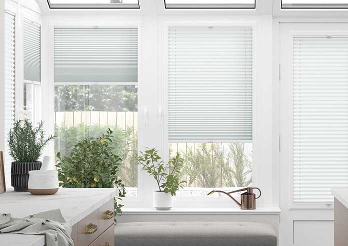 Perfect Fit White Pleated Blind in a conservatory window