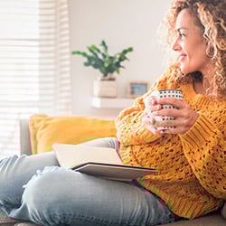 A women enjoying a brew with a book
