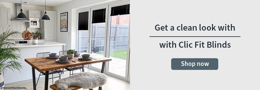 Clip Fit banner with a set of black clic fit pleated blinds in a kitchen dining room