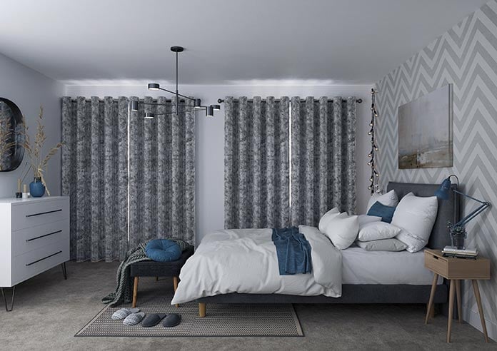 A closed blackout curtain in a bedroom is perfect for mental health