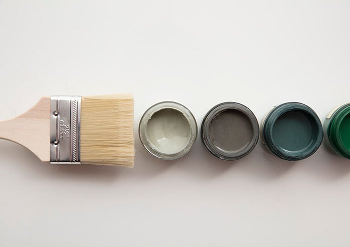 A paintbursh with some paints