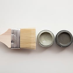 A paintbursh with some paints