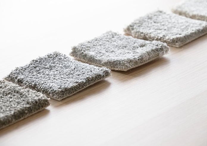 Grey carpet samples lined up for comparison