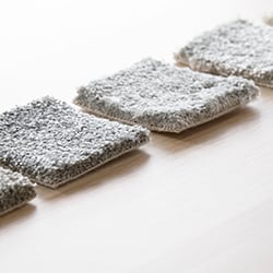Grey carpet samples lined up for comparison