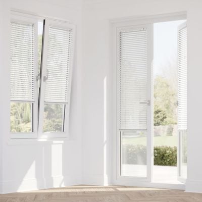 White, Venetian Stick On Blinds on patio doors and tilt and turn windows.